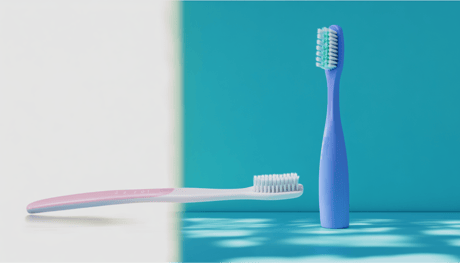 A toothbrush on a pastel background and surface